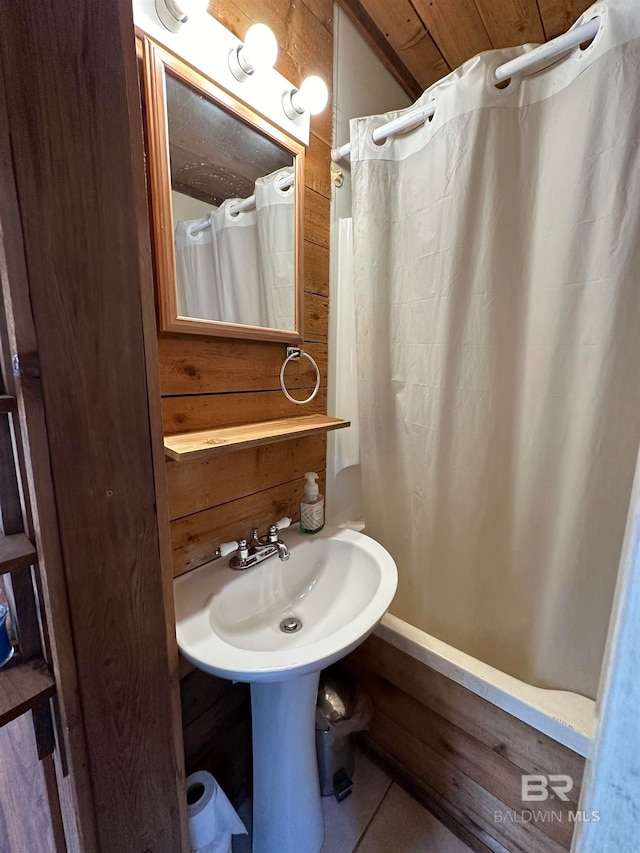 bathroom with tile patterned flooring and walk in shower