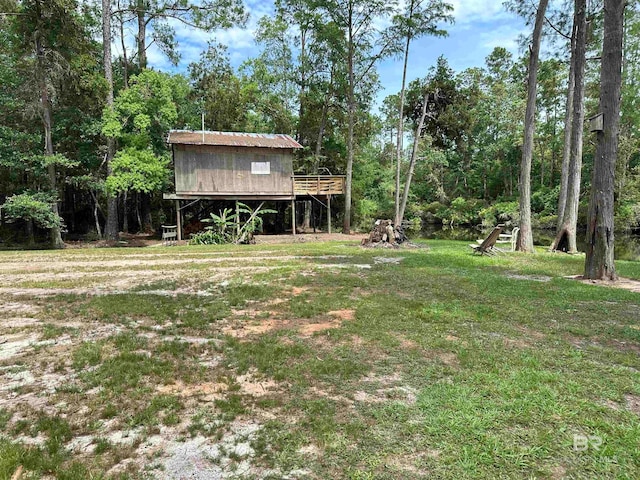 view of yard featuring a wooden deck