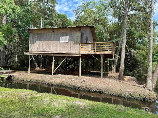 exterior space with a deck with water view