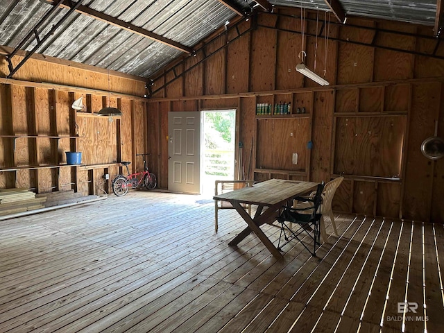 interior space featuring wood-type flooring and lofted ceiling