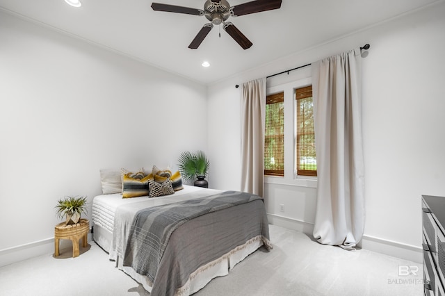 carpeted bedroom featuring baseboards, ceiling fan, and recessed lighting