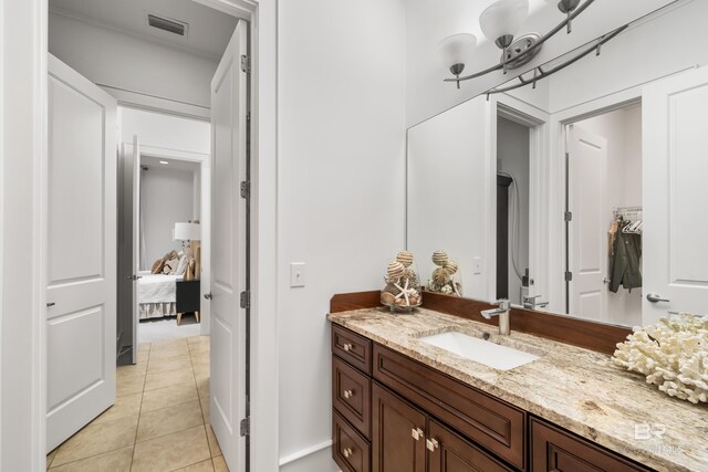 bathroom featuring tile patterned floors and vanity