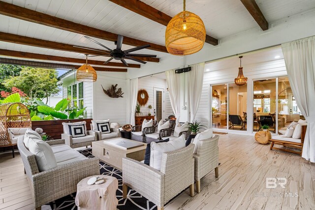 living room with light hardwood / wood-style floors, wooden ceiling, beam ceiling, ceiling fan, and wooden walls