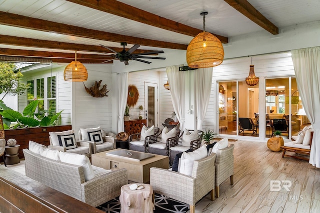 interior space with wood ceiling, ceiling fan, beam ceiling, wooden walls, and hardwood / wood-style floors