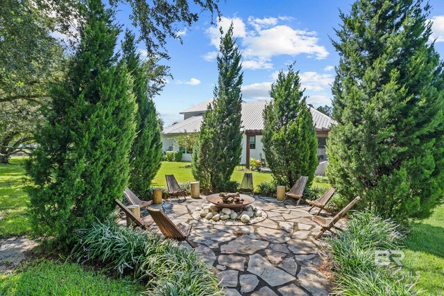 view of patio / terrace with a fire pit