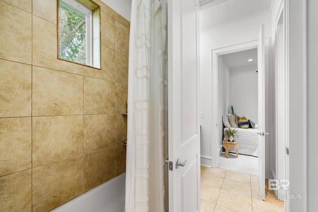 bathroom featuring tile patterned flooring and shower / bath combination with curtain