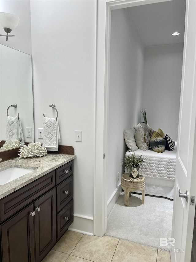 bathroom with tile patterned floors and vanity