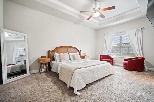 bedroom with ceiling fan, crown molding, carpet flooring, and a raised ceiling