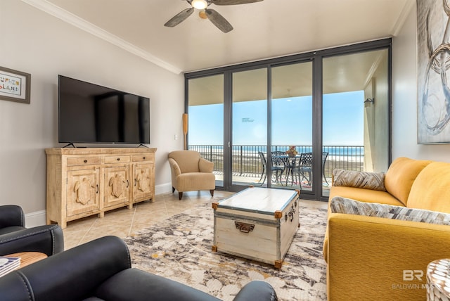 living room featuring expansive windows, ceiling fan, a water view, and ornamental molding