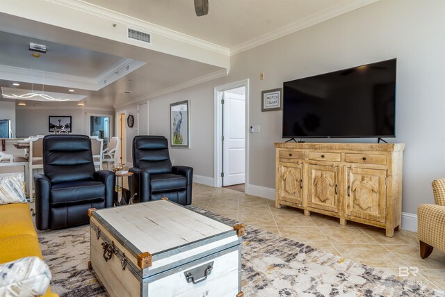 living room with light tile patterned floors and crown molding