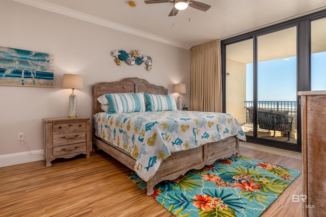 bedroom with wood-type flooring, ceiling fan, crown molding, and access to outside