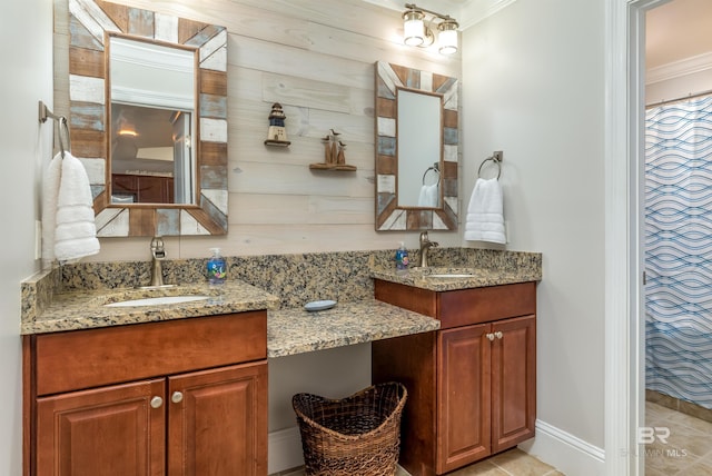 bathroom with wood walls, vanity, tile patterned floors, and ornamental molding