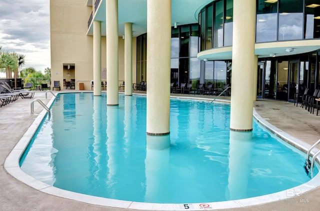 view of swimming pool featuring a patio