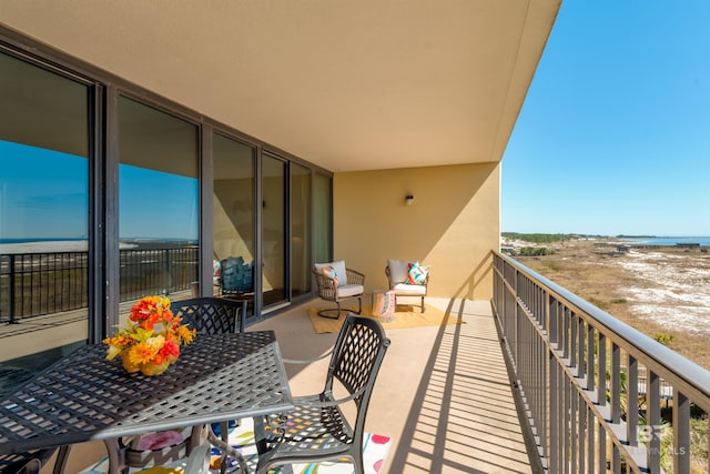 balcony featuring a water view