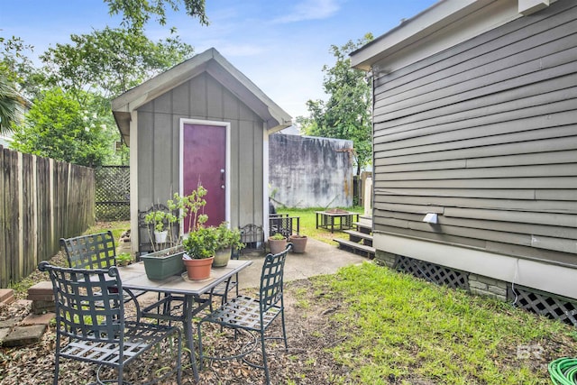 view of patio / terrace with a storage unit