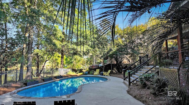 view of swimming pool with a patio area