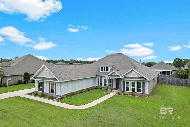 craftsman inspired home with a front lawn