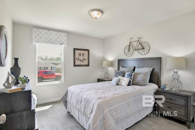 bedroom with light hardwood / wood-style floors