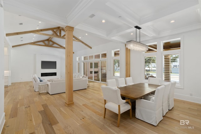 dining space with coffered ceiling, lofted ceiling with beams, light hardwood / wood-style flooring, and ornate columns