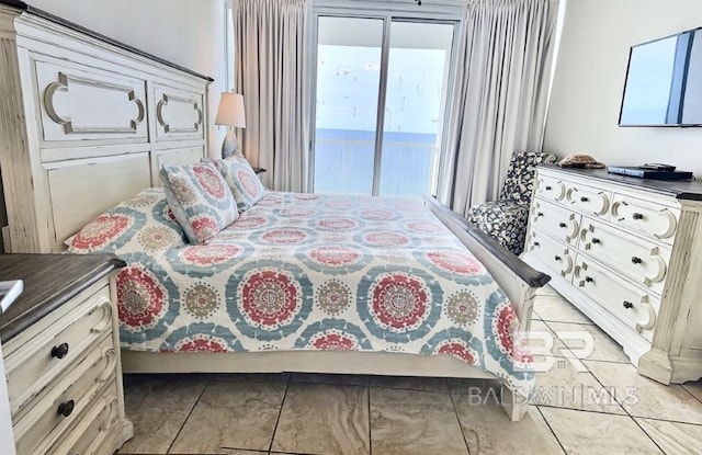 521 W Beach Blvd Unit 1703, Gulf Shores, AL 36542 - bedroom with access to outside and light tile patterned floors