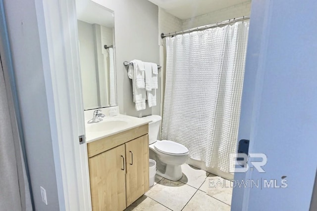 521 W Beach Blvd Unit 1703, Gulf Shores, AL 36542 - bathroom featuring toilet, shower / bathtub combination with curtain, tile patterned flooring, and vanity
