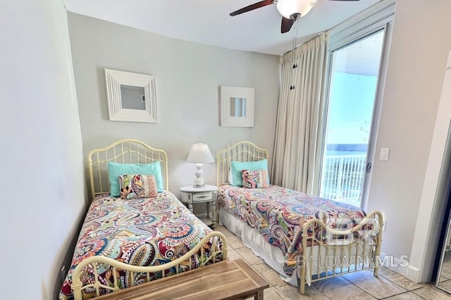 521 W Beach Blvd Unit 1703, Gulf Shores, AL 36542 - bedroom with tile patterned flooring, ceiling fan, and access to outside