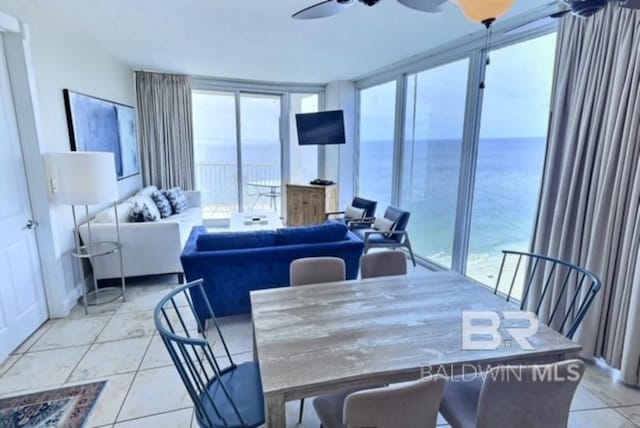 521 W Beach Blvd Unit 1703, Gulf Shores, AL 36542 - dining space with expansive windows and light tile patterned floors