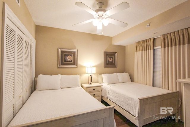 bedroom with ceiling fan and a closet