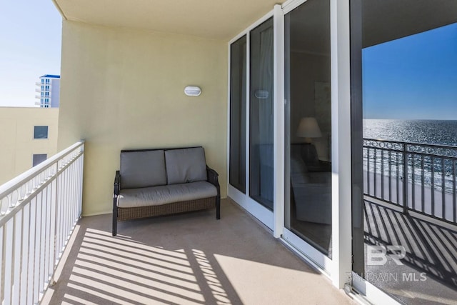 balcony featuring a water view