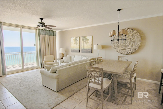 interior space featuring a textured ceiling, crown molding, and a water view