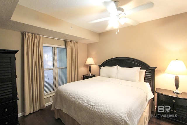 bedroom featuring ceiling fan and dark wood-type flooring