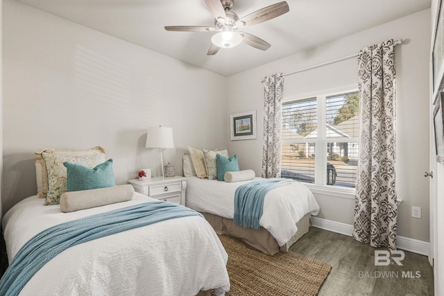 bedroom featuring hardwood / wood-style floors and ceiling fan