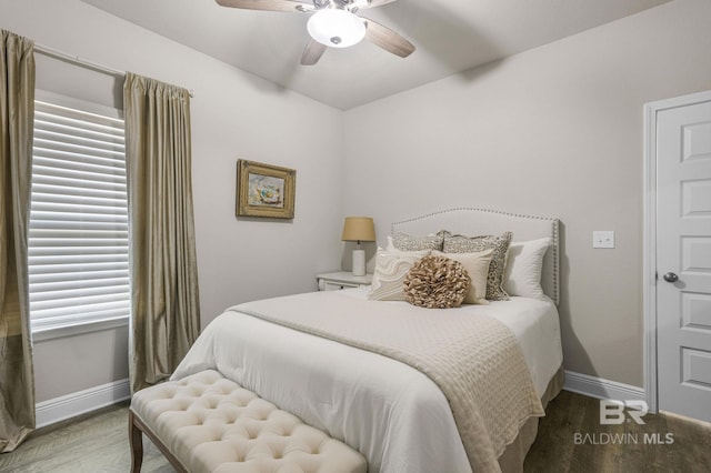 bedroom with hardwood / wood-style flooring and ceiling fan