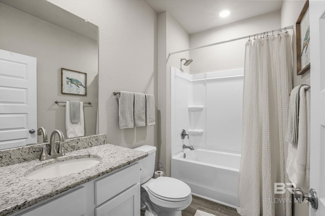 full bathroom with toilet, vanity, shower / bathtub combination with curtain, and wood-type flooring