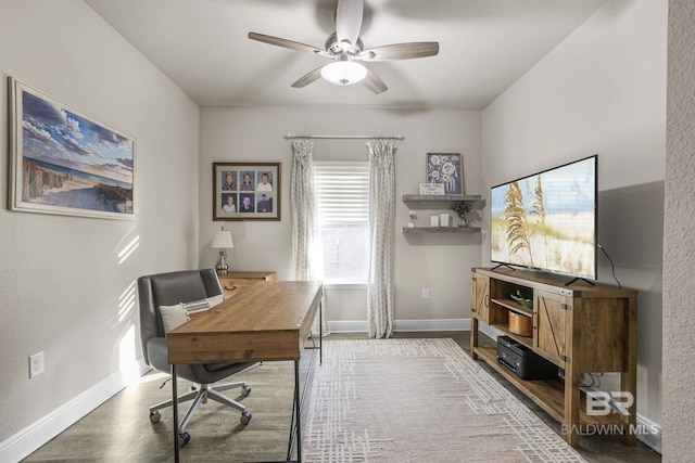 office area with wood-type flooring and ceiling fan