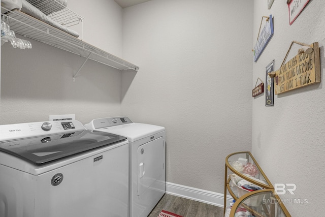 washroom featuring dark hardwood / wood-style flooring and separate washer and dryer