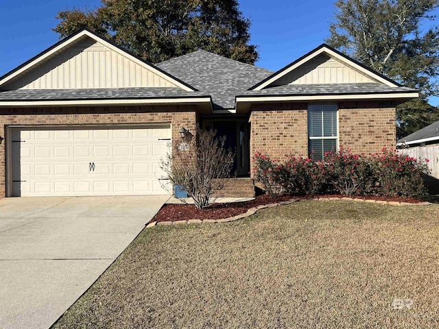 view of front facade featuring a front lawn and a garage