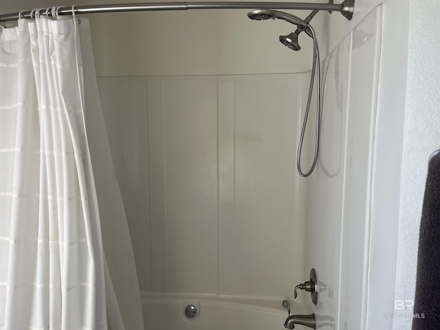 bathroom featuring shower / bathtub combination with curtain