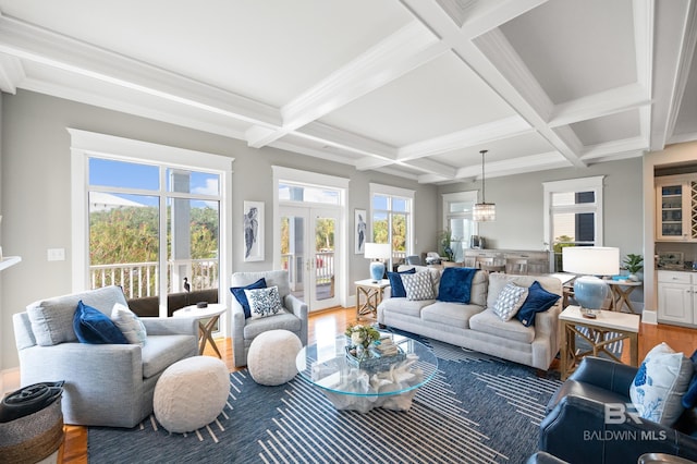 living room with coffered ceiling, wood-type flooring, french doors, ornamental molding, and beamed ceiling