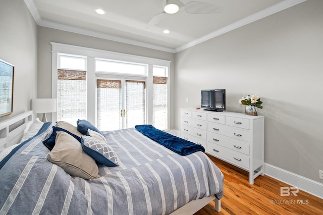 bedroom with ceiling fan, crown molding, and light hardwood / wood-style floors