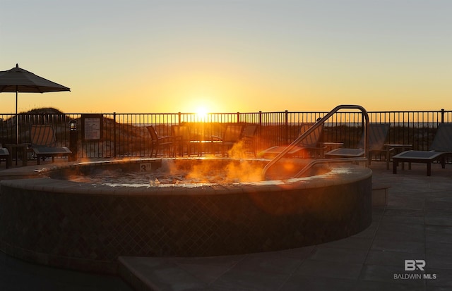 view of patio terrace at dusk