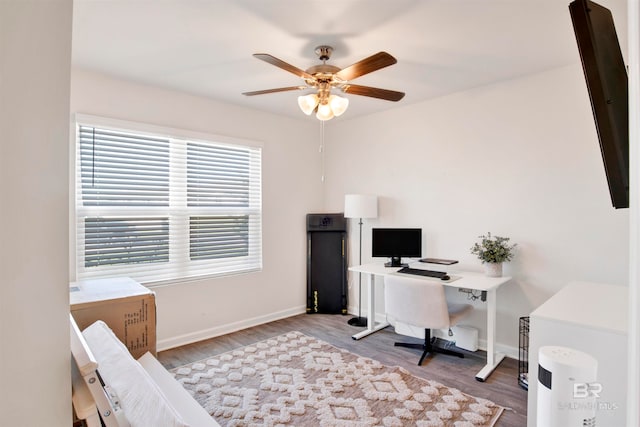 office with ceiling fan and light hardwood / wood-style floors