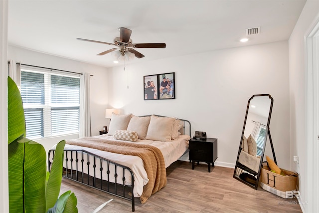 bedroom featuring ceiling fan and light hardwood / wood-style floors