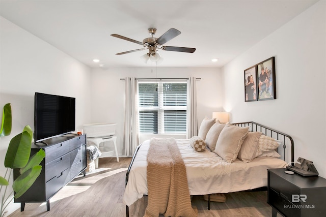 bedroom featuring ceiling fan and light wood-type flooring