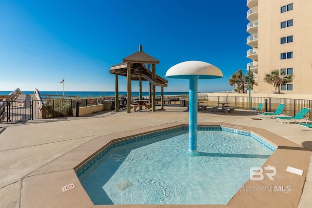 24132 Perdido Beach Blvd Unit 1063, Orange Beach, AL 36561 - pool featuring fence, a water view, and a patio area