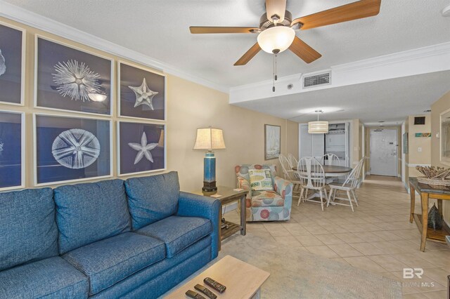 24132 Perdido Beach Blvd Unit 1063, Orange Beach, AL 36561 - living room with ceiling fan, ornamental molding, visible vents, and light tile patterned floors