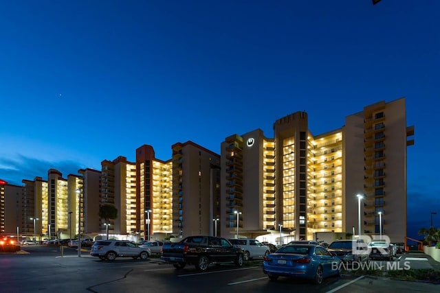 24132 Perdido Beach Blvd Unit 1063, Orange Beach, AL 36561 - view of building exterior featuring uncovered parking