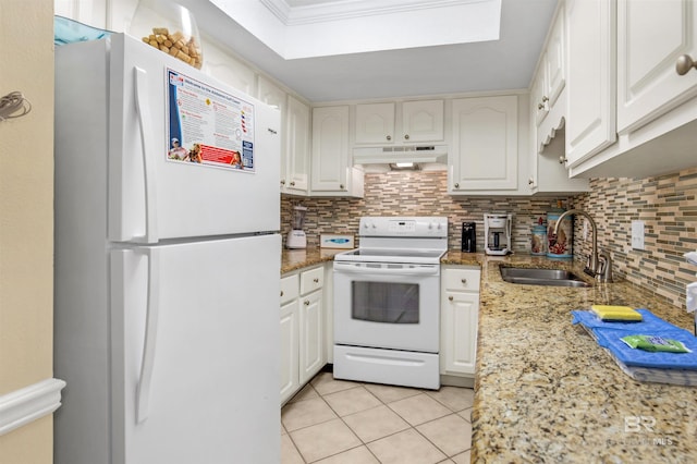 24132 Perdido Beach Blvd Unit 1063, Orange Beach, AL 36561 - kitchen featuring under cabinet range hood, a sink, light tile patterned floors, white appliances, and decorative backsplash
