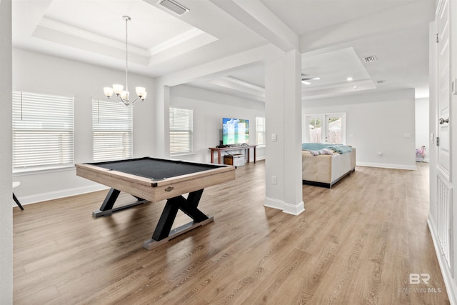 recreation room with crown molding, a tray ceiling, light hardwood / wood-style flooring, and pool table