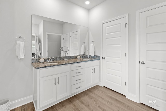 bathroom featuring vanity and hardwood / wood-style floors